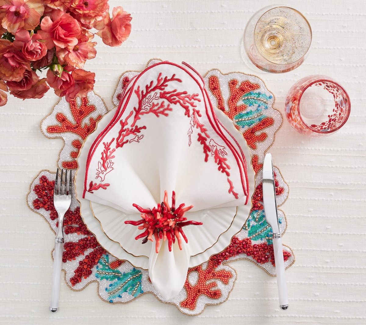 Kim Seybert Amalfi Napkin Ring in Coral Set of 4 in a Gift Box by Kim Seybert - CORAL 3.25"L x 2.25"W x 3.5"H Napkin Ring - Set of 4 at FIG LINENS AND HOME - 3