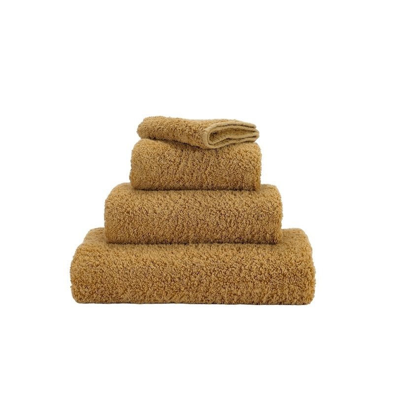 Abyss Super Pile Guest Towel 12x20 Gold 840 - View 1 at Fig Linens and Home