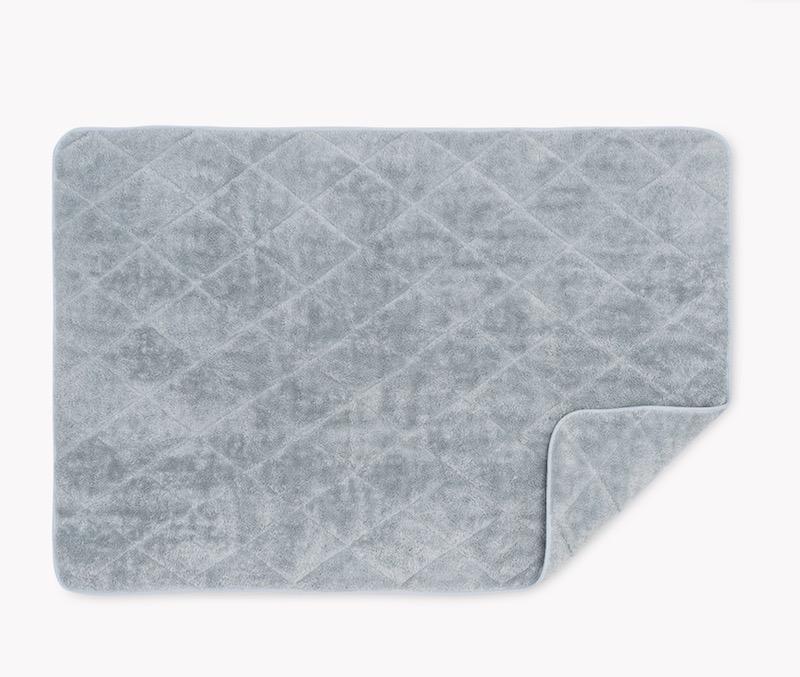 Cairo Quilted Tub Mat by Matouk | Pool with Pool Trim