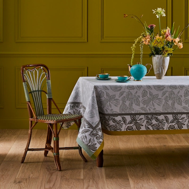 Yves Delorme Tablecloth & Napkins - Parfum Fougere Table Linens shown on table with flowers