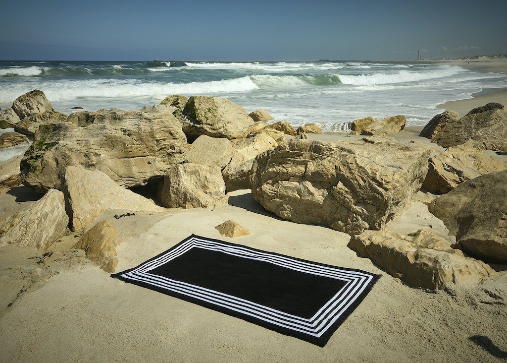 Cannes Beach Towels by Abyss and Habidecor | Fig Linens and Home - Towels shown by the Ocean