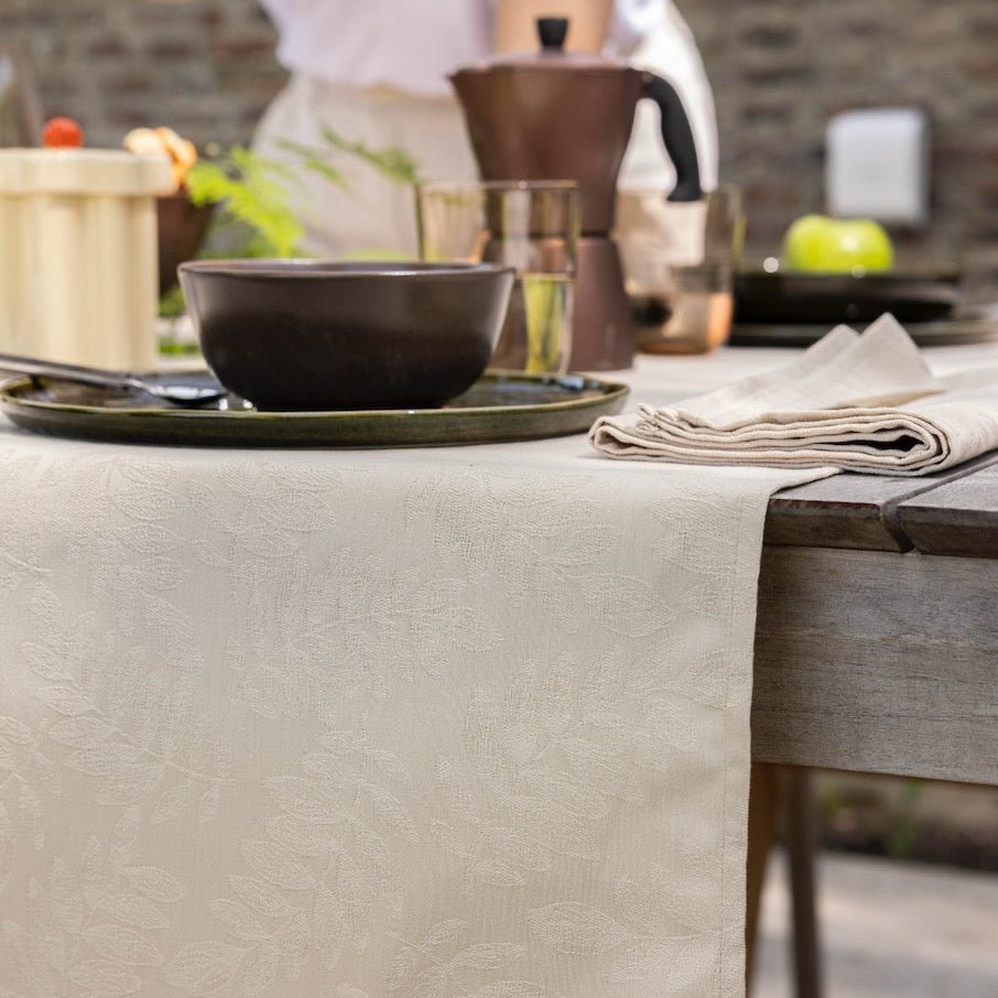Vegetal Mood Cajou Beige Tablecloth By Le Jacquard Francais at Fig Linens and Home 1