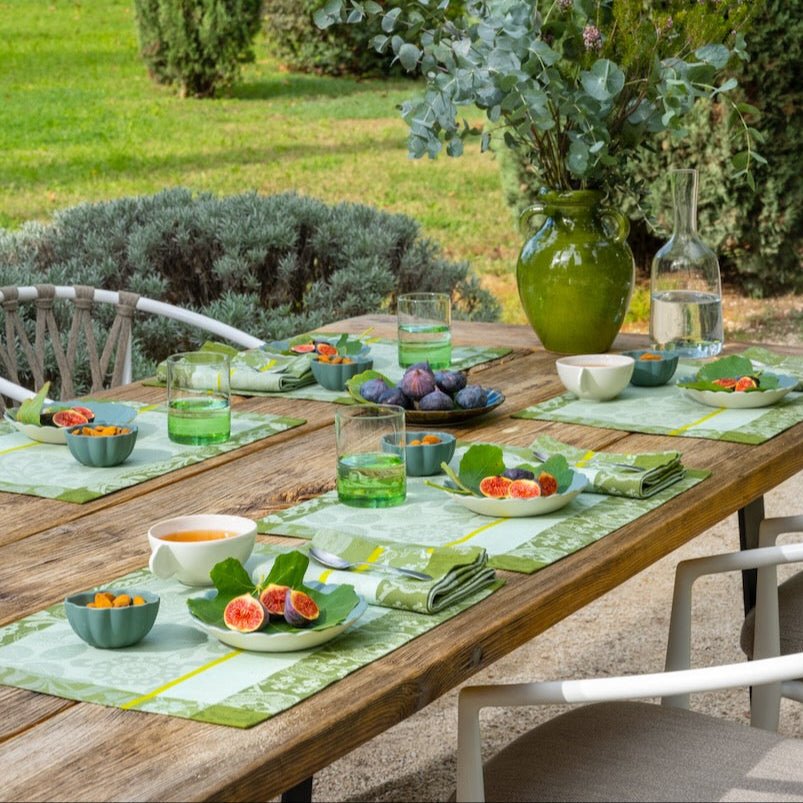 Lifestyle Photograph - Voyage Iconique Green Napkins By Le Jacquard Francais at Fig LInens and Home