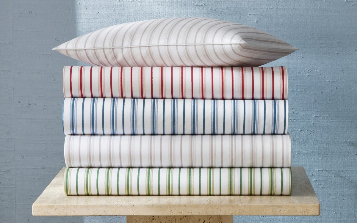Calypso Bedding by Matouk Schumacher at Fig Linens and Home - Stack of all Colors