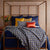 Linea Navy Blue Coverlet Set by Ann Gish - Shown with duvet cover and yellow pillows