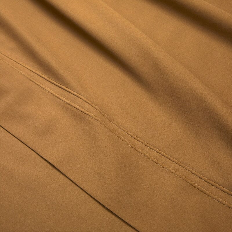Flat Sheet Detail in Triomphe Bronze Bed Linens | Yves Delorme Bedding at Fig Linens and Home