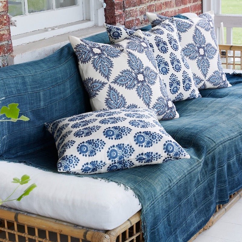 Adira Indigo Indoor Outdoor Pillow shown with other Outdoor Cushions on Patio - John Robshaw