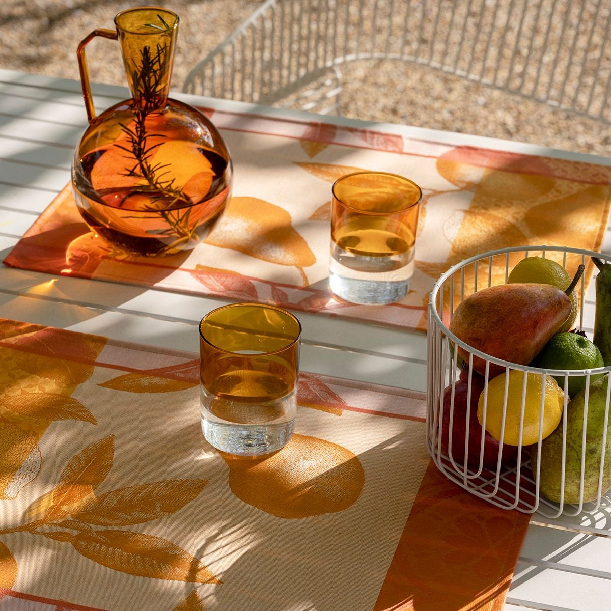 Arrière-Pays Orange Table Linens by Le Jacquard Français - lifestyle shot