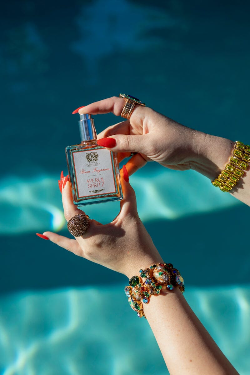 Aperol Spritz Room Spray by Antica Farmacista in Jeweled Hand at Pool - Fig Linens and Home