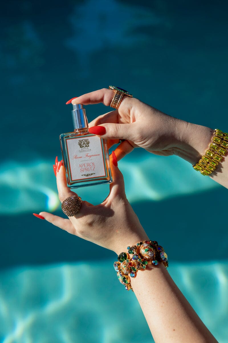 Aperol Spritz Room Spray by Antica Farmacista in Jeweled Hand at Pool -  Fig Linens and Home