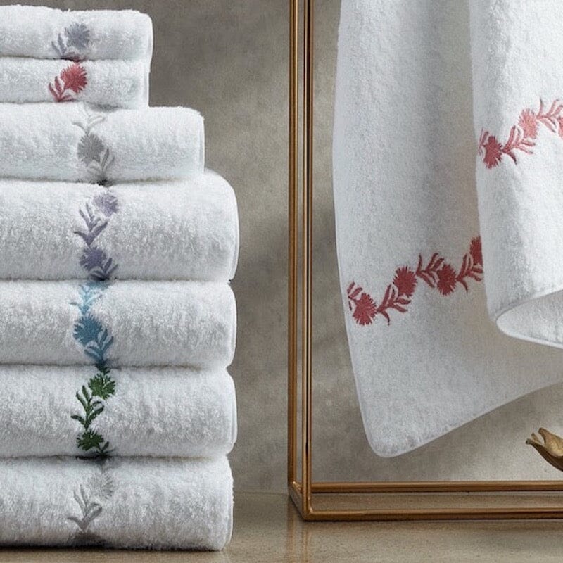 Daphne floral towels from matouk in a stack for fig linens and home