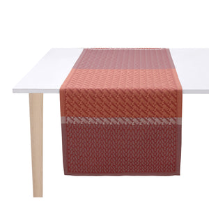Veine Graphique Red Table Runner by Le Jacquard Francais shown on white table