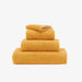 Abyss Super Pile Hand Towel 17x30 Curcuma 870 - View 1 at Fig Linens and Home