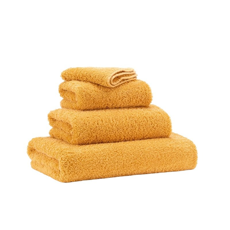 Abyss Super Pile Wash Mitt 7x9 Curcuma 870 - View 2 at Fig Linens and Home