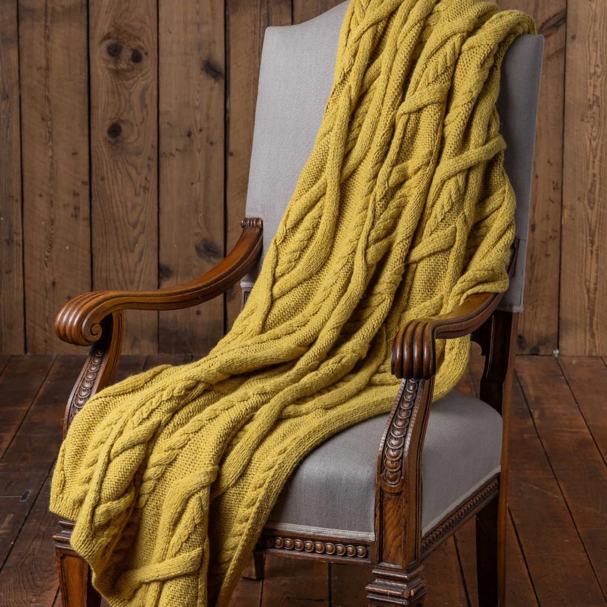 Alicia Adams Alpaca Buckley Throw in French Yellow on Chair