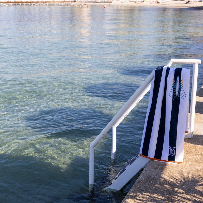 Yves Delorme Tribord Beach Towel | Navy and White Rowing Skiff Pool Towel at Fig Linens and Home - 1