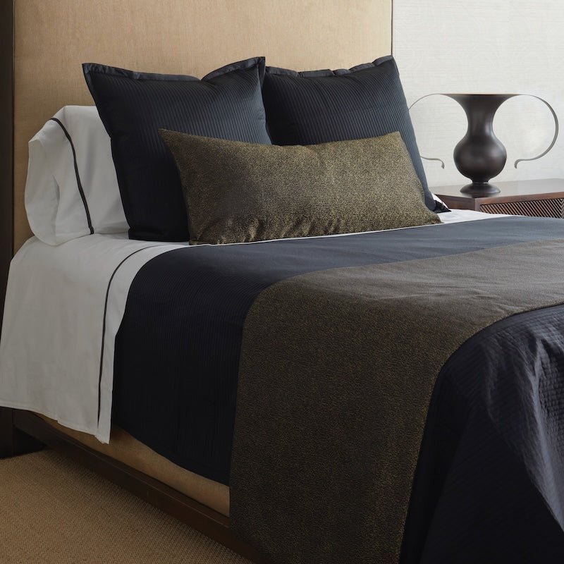 Ann Gish - Dapple Black and Gold Art of Home Bed Finisher shown on black Bedding - angle View