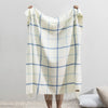 Lands Downunder Blanket - Blue Denim and Baby Blue Tattersall Throw being Held to show Fringe