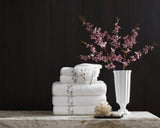 Matouk Jasmine Giza Terry Towels in a Stack - Lifestyle 1 at Fig Linens and Home