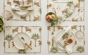 Tiger Palm Placemats by Matouk Schumacher - Shown on Table with Napkins, Fruit and Cutlery