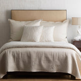 Prestige Throw Pillows Natural by Ann Gish - Square Pillows shown on Bed with Blanket | Fig Linens and Home