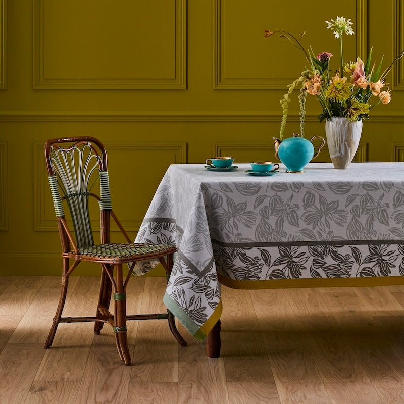Yves Delorme Tablecloth &amp; Napkins - Parfum Fougere Table Linens shown on table with flowers
