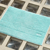 Yves Delorme Plain Aruba Blue Tub Mat by Hugo Boss Home - Bath Mat 20 x 28 Plain Aruba Blue at FIG LINENS AND HOME - 1