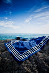 Cannes Beach Towels by Abyss and Habidecor | Fig Linens and Home - Towels shown by the Ocean - 2