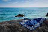 Cannes Beach Towels by Abyss and Habidecor | Fig Linens and Home - Towels shown by the Ocean - 3