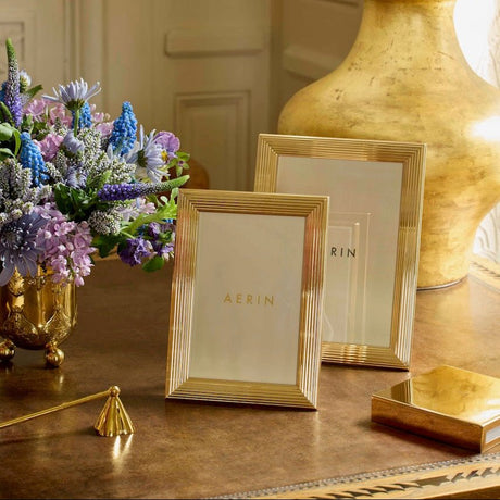 AERIN Alessio 5 x 7 Photo Frame | Reeded Gold-Finish Picture Frame Shown with Smaller Frame on Table