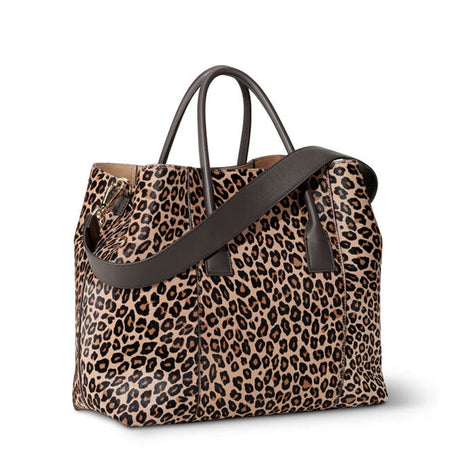Mini Weekender Bag in Leopard by AERIN at Fig Linens and Home - Shown with Leather Handles