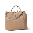 Mini Weekender in Sand Suede by AERIN at Fig Linens and Home - Angle View with Crossbody Strap