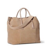 Mini Weekender in Sand Suede by AERIN at Fig Linens and Home - Angle View with Crossbody Strap