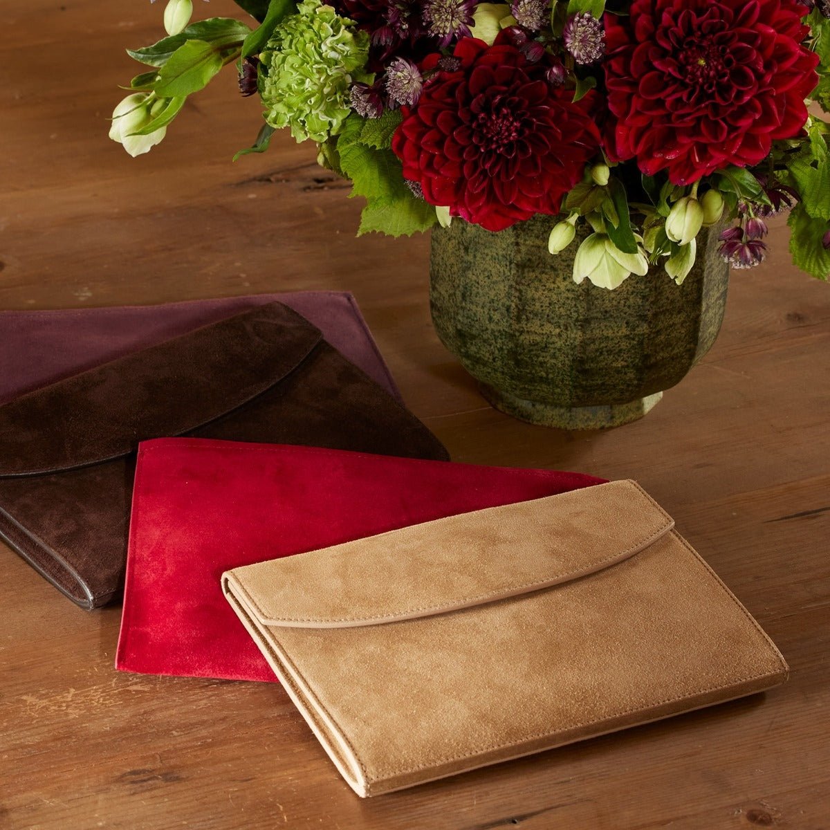 AERIN Suede Envelope Clutches shown together all colors at Fig Linens and Home