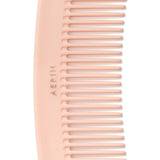 Travel Pink Pastel Comb by AERIN - Detail View of Logo at Fig Linens and Home