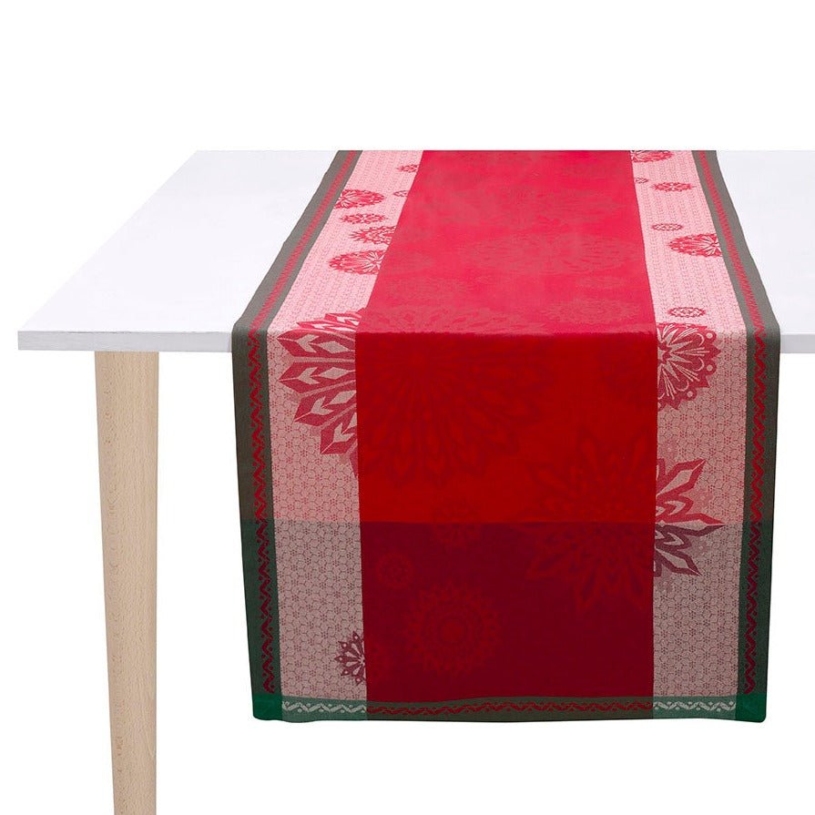 lumière d'étoiles red table runner by Le Jacquard Francais - shown on tall table
