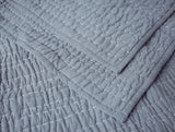 Coyuchi Channel Handstitched Organic Quilted Coverlets - Indigo Chambray at Fig Linens and Home 1