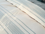 Coyuchi Rippled Stripe Undyed & Surf Organic Bedding at Fig Linens and Home - Fabric Detail View 1