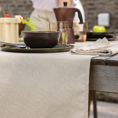 Vegetal Mood Cajou Beige Tablecloth By Le Jacquard Francais at Fig Linens and Home 1