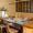 Voyage Iconique Enduit Grey Coated Tablecloth By Le Jacquard Francais at Fig Linens and Home 1