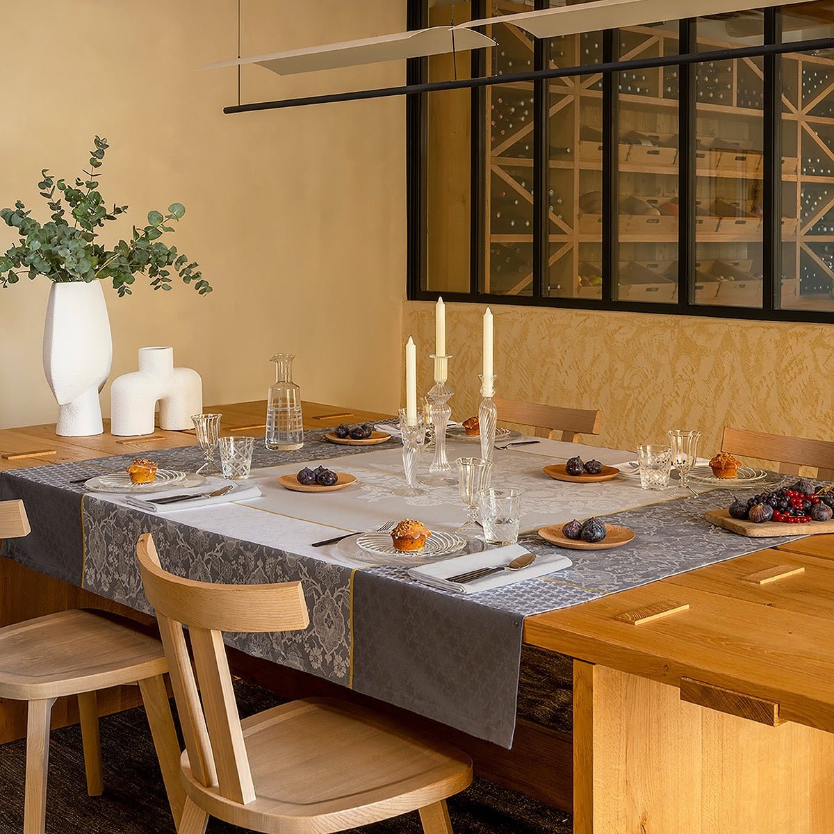 Voyage Iconique Enduit Grey Coated Tablecloth By Le Jacquard Francais at Fig Linens and Home 1