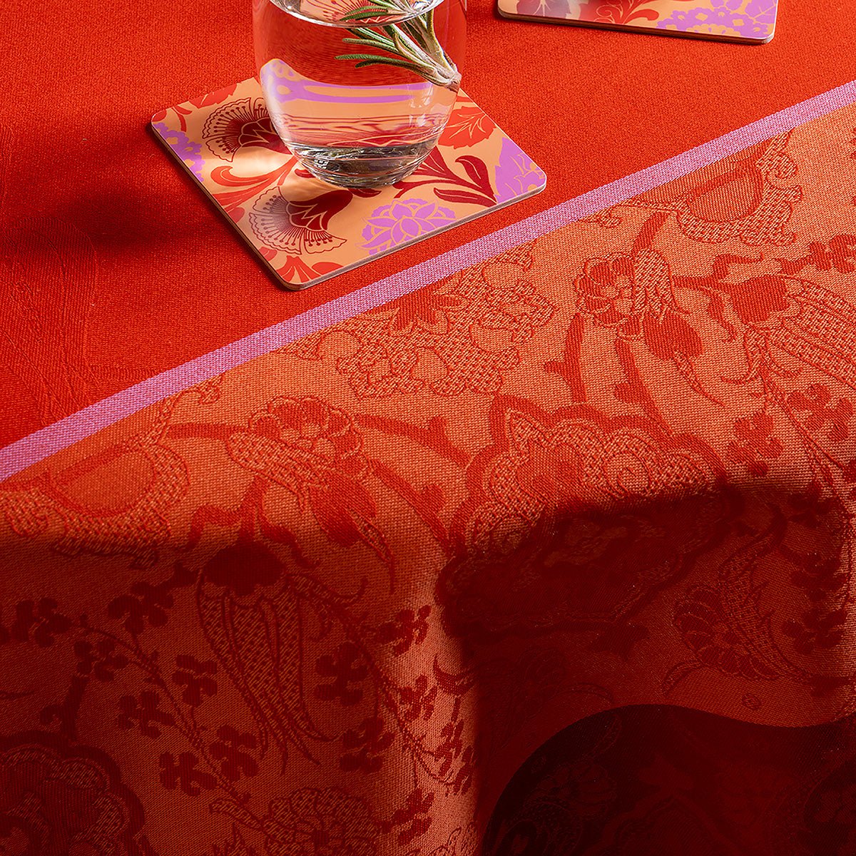 Voyage Iconique Enduit Red Coated Tablecloth By Le Jacquard Francais - Outdoor Table Linens 2