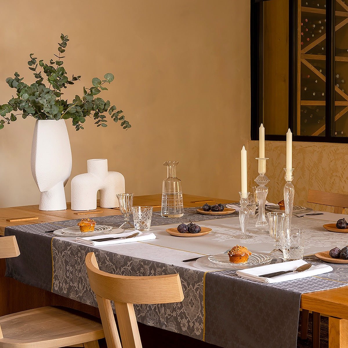 Voyage Iconique Grey Tablecloth By Le Jacquard Francais at Fig Linens and Home - Lifestyle 1