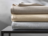 Avalon Cotton Blankets by Matouk shown in a Stack - Fig Linens and Home