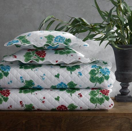 Geranium Quilts by Matouk x Tillett shown in a Stack at Fig Linens and Home