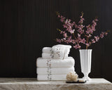 Matouk Jasmine Giza Terry Towels in a Stack - Lifestyle 1 at Fig Linens and Home