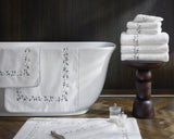 Matouk Jasmine Giza Terry Towels in a Stack - Lifestyle 2 at Fig Linens and Home