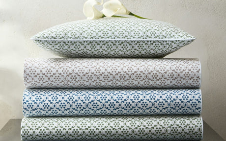 Laksha Flat Sheets by Matouk Schumacher at Fig Linens and Home | Stack of Printed Sheets