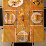 Manor Lane Enduit Orange Coated Tablecloth by Le Jacquard Français