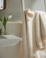 Indulgence Bath Towels by Scandia Home | Fig Linens and Home - Lifestyle View with Ivory Towels